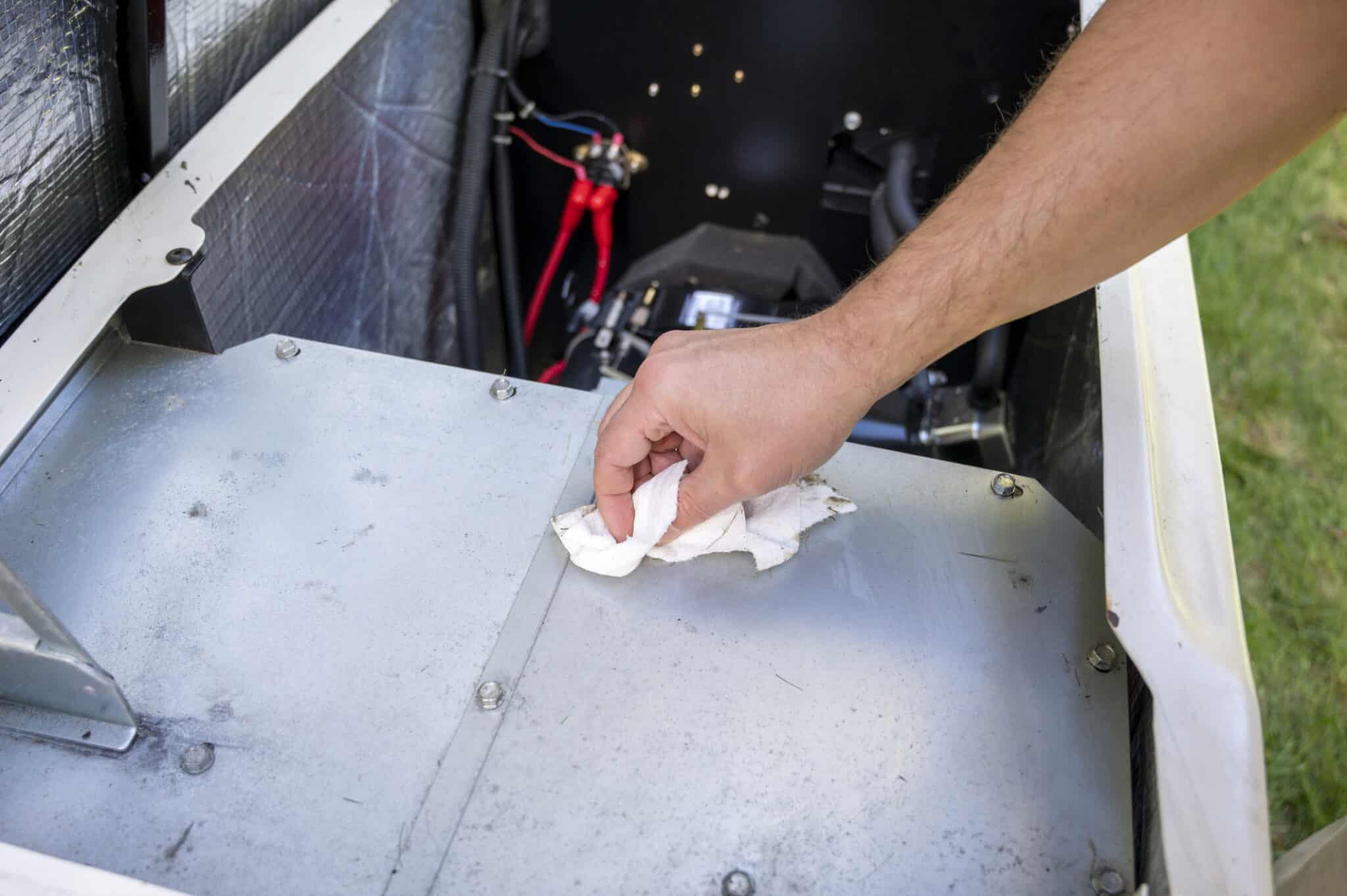Mechanic inspecting or checking the generator, Whole house generator testing.