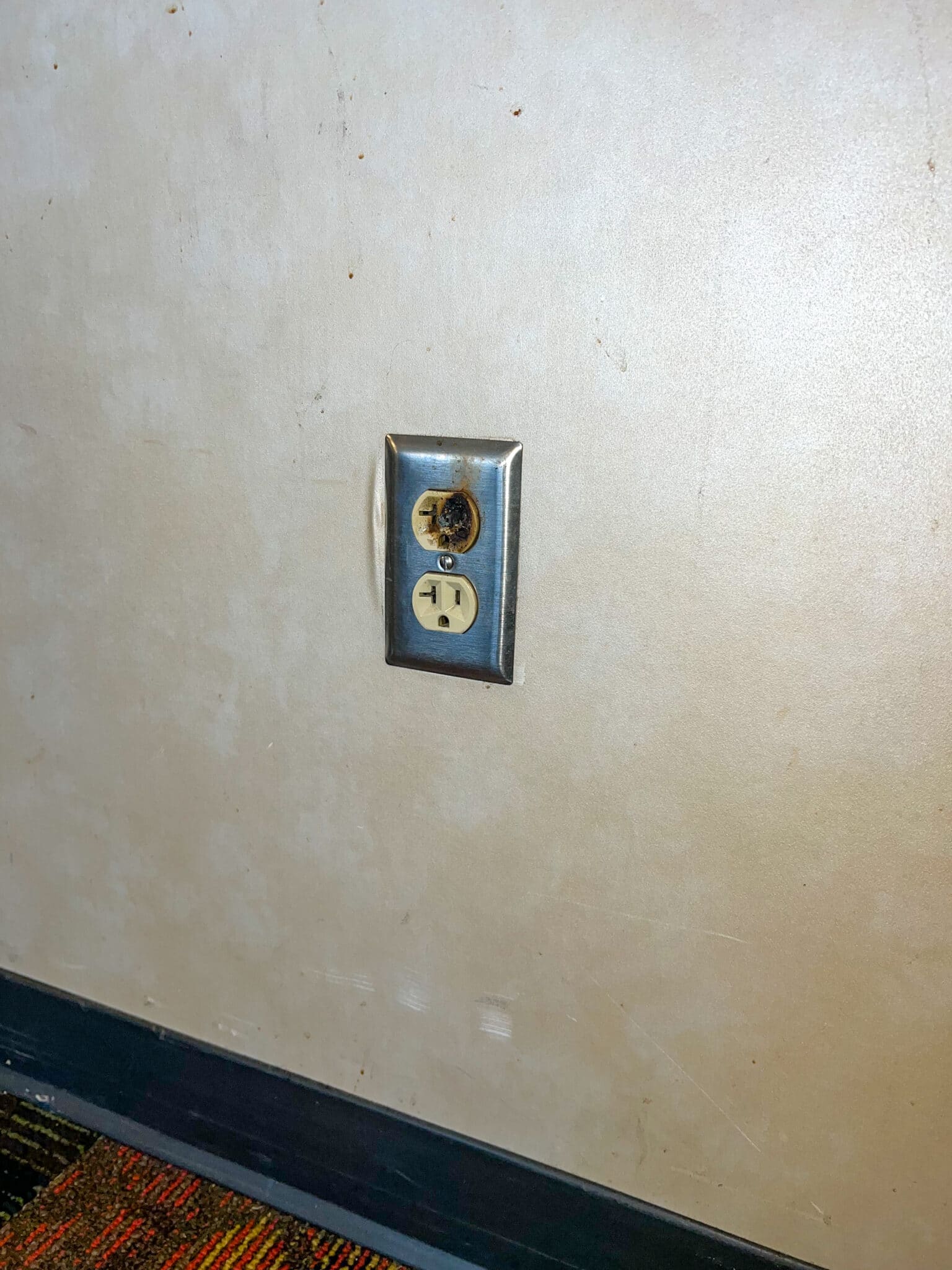 Damaged faulty electrical outlet on wall presented a hazard, Electrical troubleshooting.