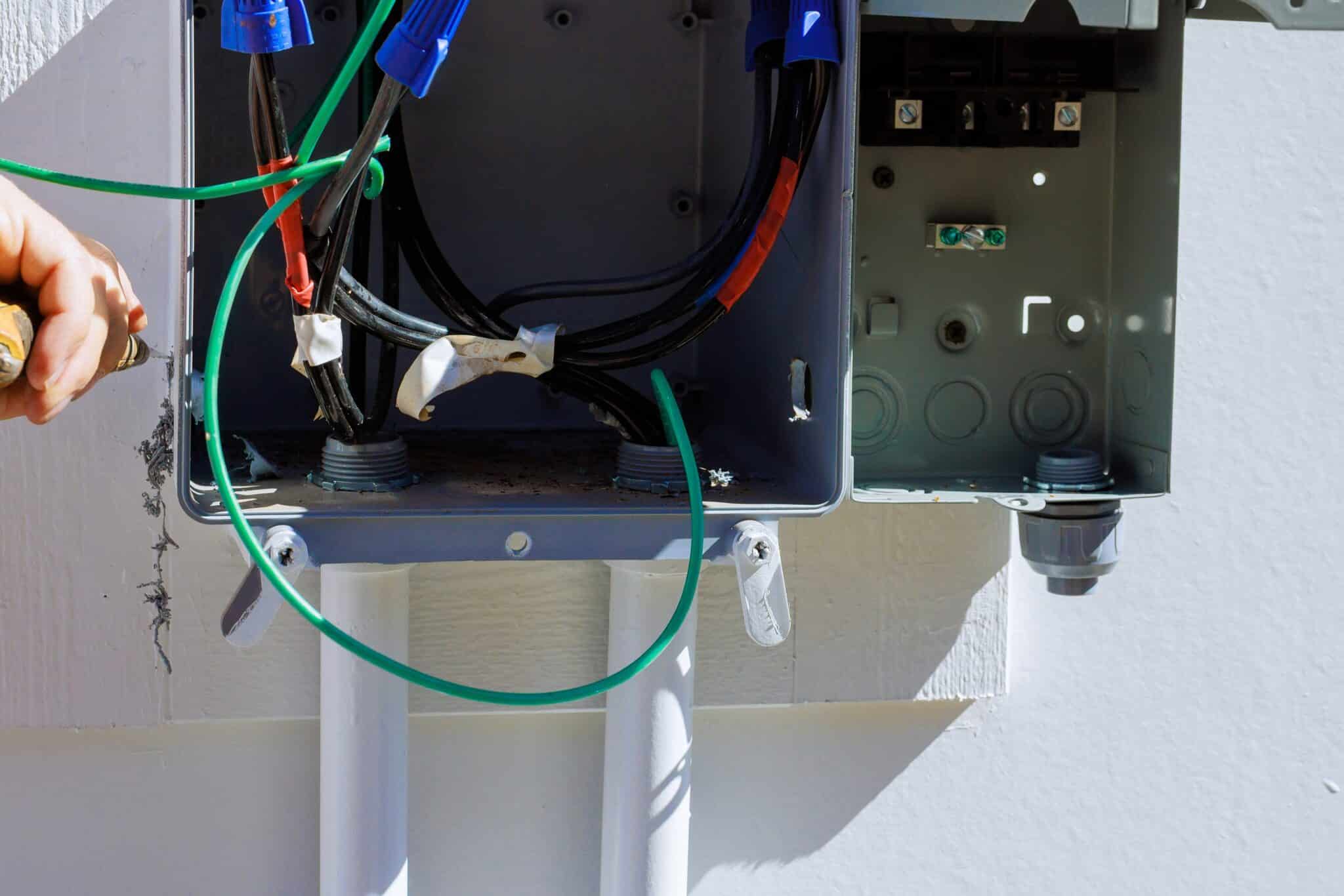 Electrician inspection electrical box, handling wires tools, Surge risk assessment.